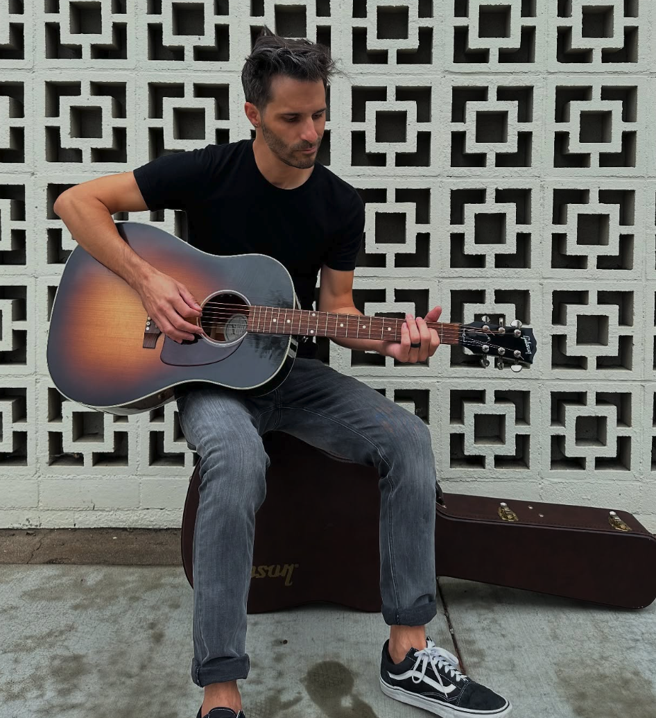 Team Member with Guitar